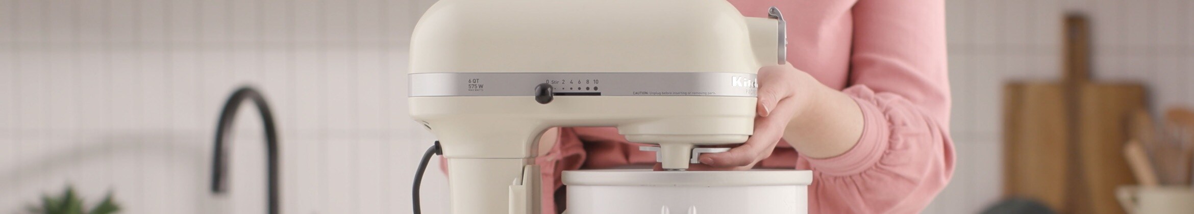 Woman using a Stand Mixer attachment