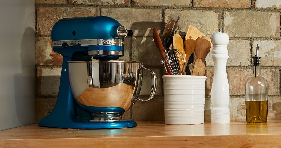 A light blue KitchenAid stand mixer on a countertop