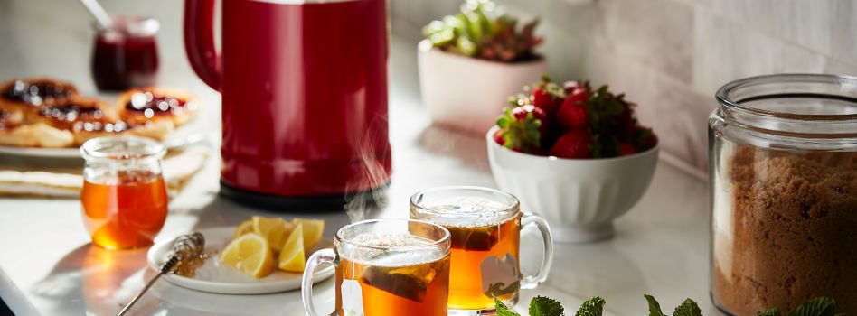 A delightful assortment of accompaniments that pair perfectly with Babka, including tea and fresh fruit.