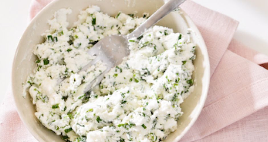 A bowl and fork are adorned with a delightful spread, poised to enhance the dough with delectable flavours.