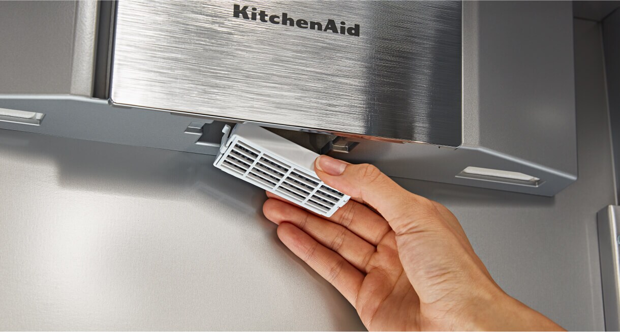 A person removing the FreshFlow™ Air Filter