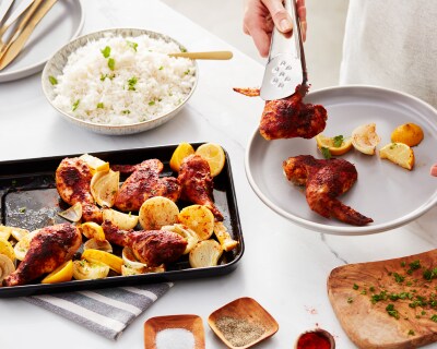 Person arranging food with tongs