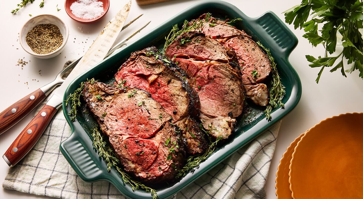 Herb-seasoned meat in a casserole pan