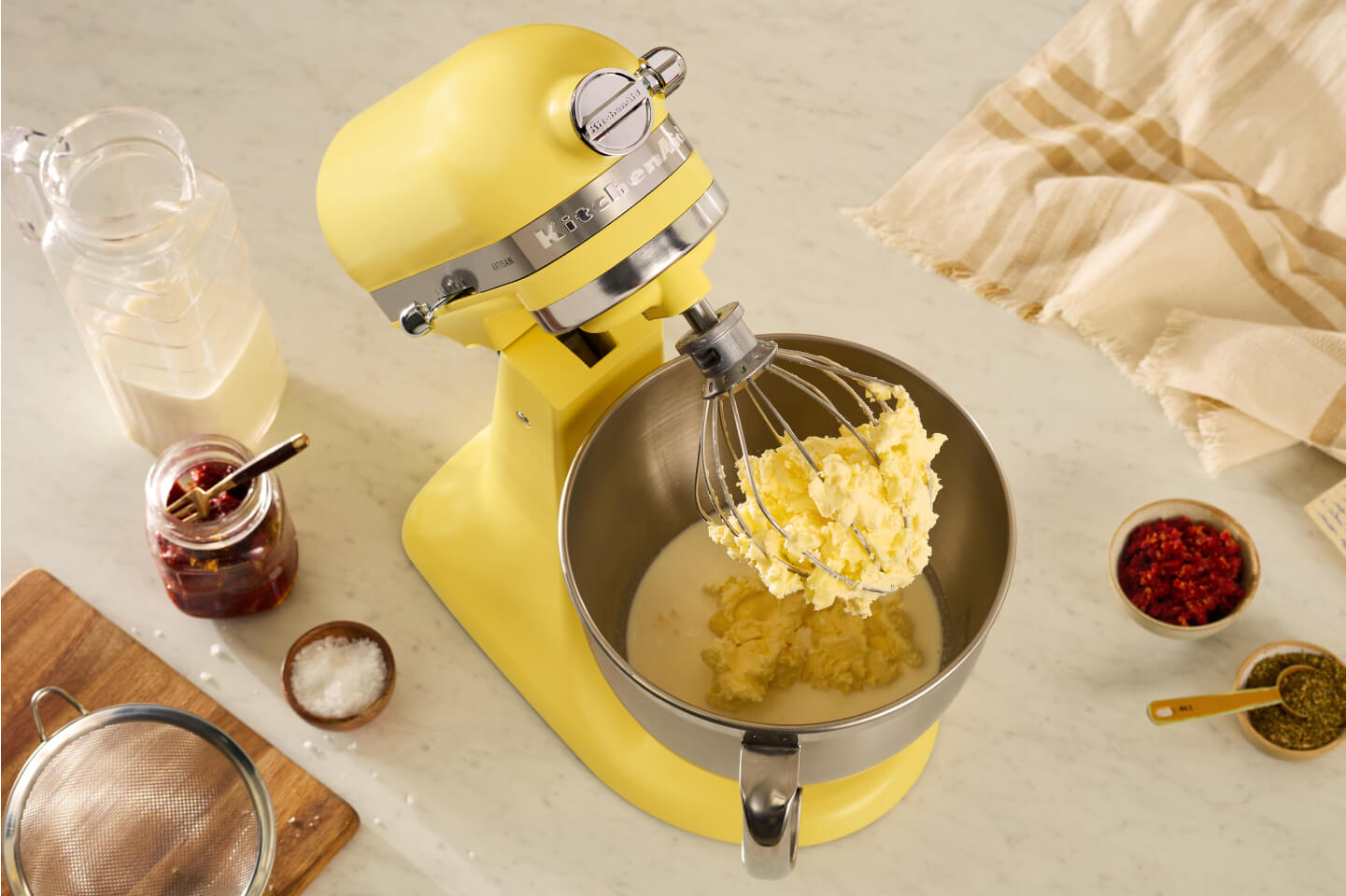 An Artisan® Series Stand Mixer in Butter.