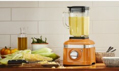 A KitchenAid® Go™ Cordless Top Down Chopper on a kitchen shelf.