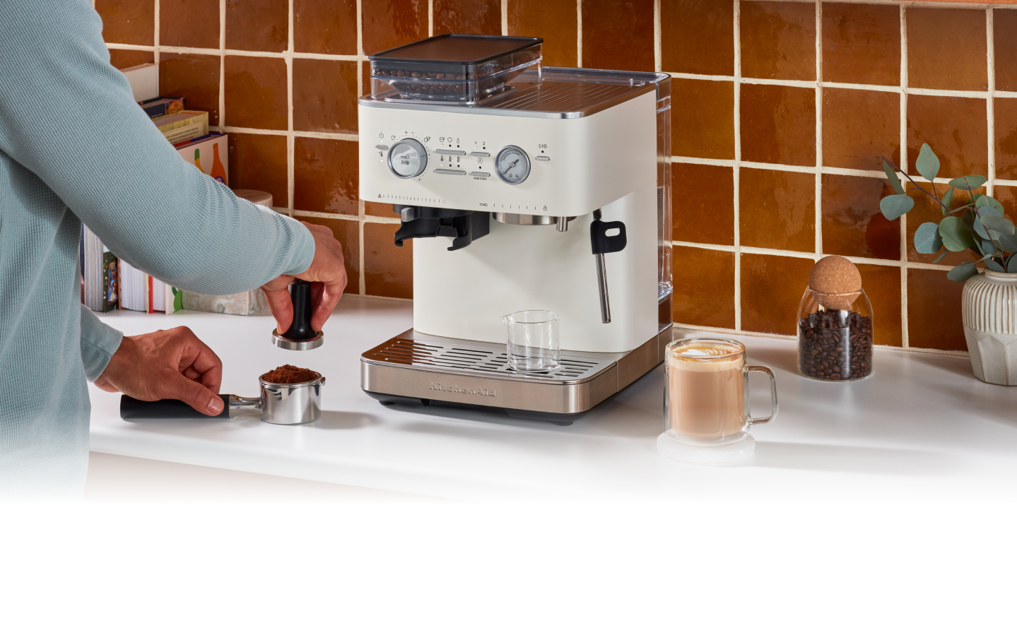 An espresso drink on a white marble countertop.