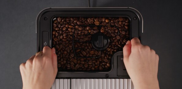 Two cups of espresso on an espresso machine drip tray
