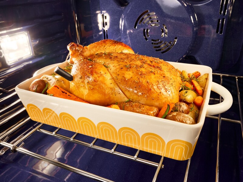 A cooked turkey and vegetables in a KitchenAid® wall oven
