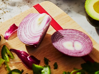 Sliced onion resting on a cutting board.