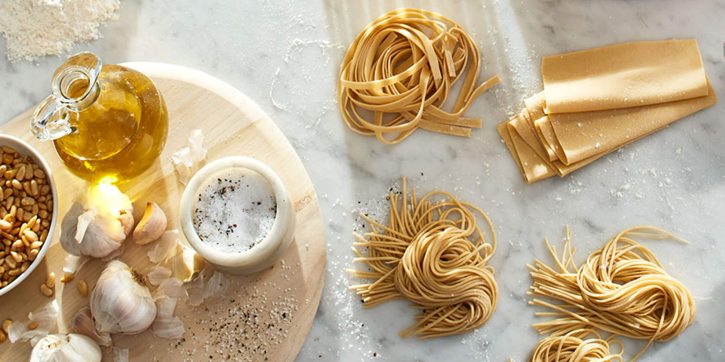 Homemade pasta and KitchenAid® pasta attachments on counter