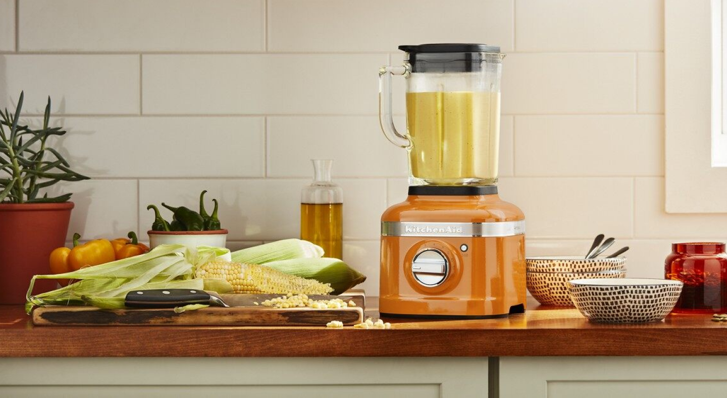 Food blending in an orange KitchenAid® blender
