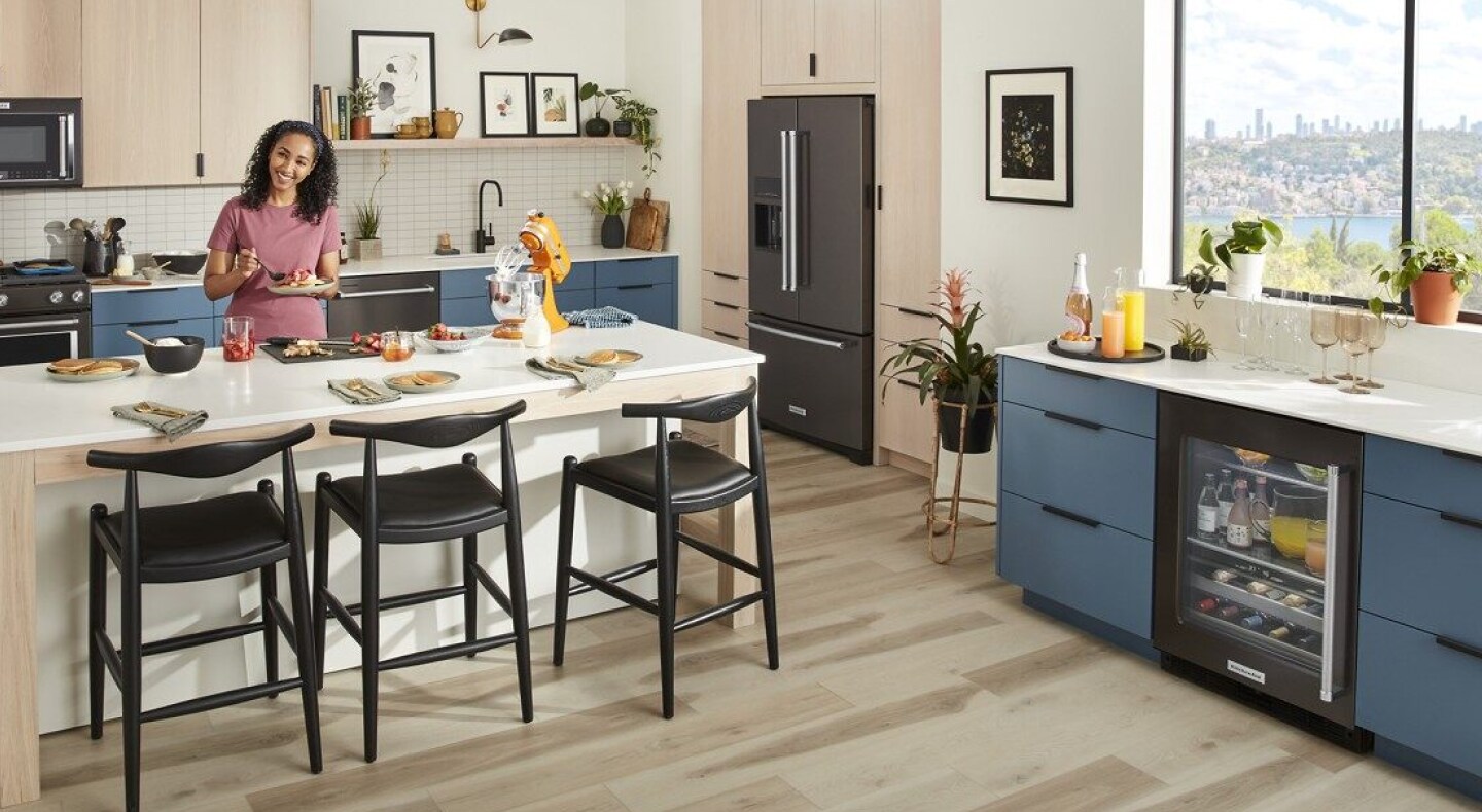 Person eating inside a contemporary kitchen