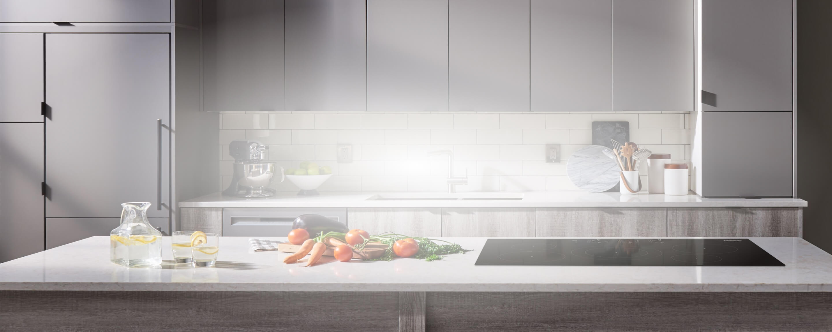 A clean kitchen with a Sensor Induction Cooktop.