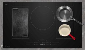 Various pans on an induction cooktop.