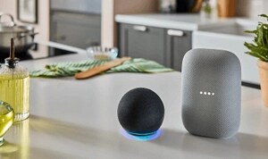 An Amazon Alexa and Google Home sitting on a countertop.