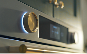 The backlit knobs on a wall oven.