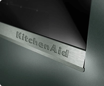 A close up of the embossed KitchenAid brand logo on the Juniper range.