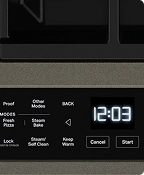 A close up of the user interface of a stainless steel range.