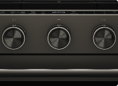 A close up on the knobs of a Black Ore oven.