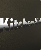 A close up of the embossed KitchenAid brand logo on the Black Ore range.