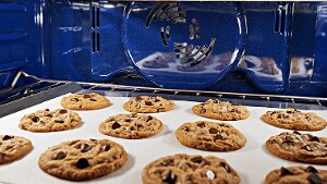 A tray of cookies baking inside an oven.