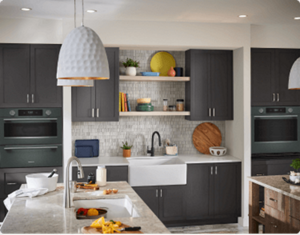 A contemporary kitchen in charcoal grey with KitchenAid® appliances.
