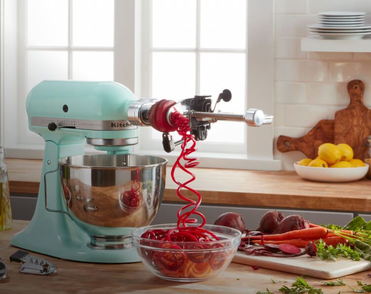 Aqua-colored Stand Mixer making beet zoodles.