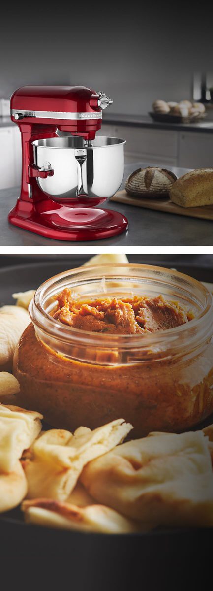 Red Pro Line® Stand Mixer next to an array of pita chips with a delicious-looking sauce in the middle.