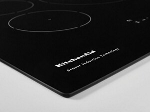  Closeup of a KitchenAid brand induction cooktop’s surface