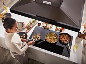 Person cooking on an induction cooktop
