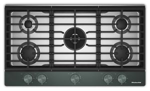 Gas-on-Metal Cooktop with an Integrated Wok Grate and CookShield